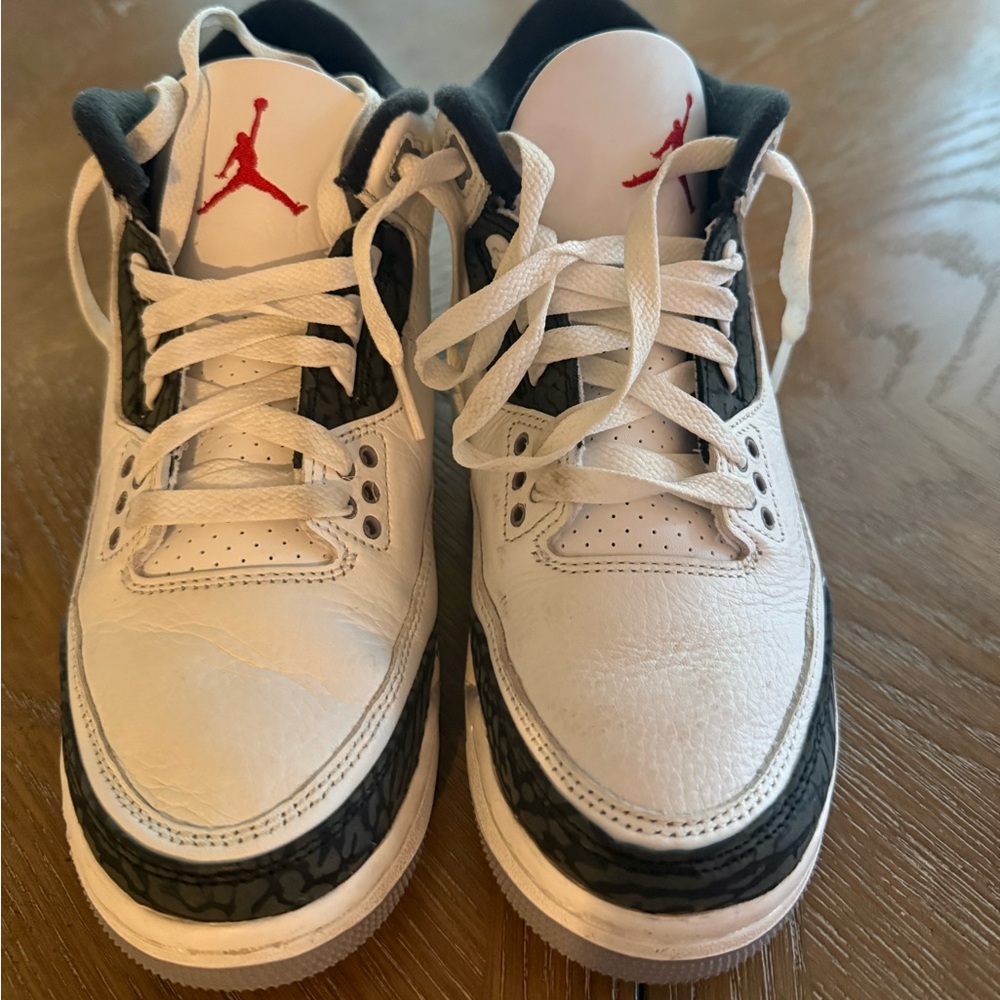White and Black Sneakers with Red Logo